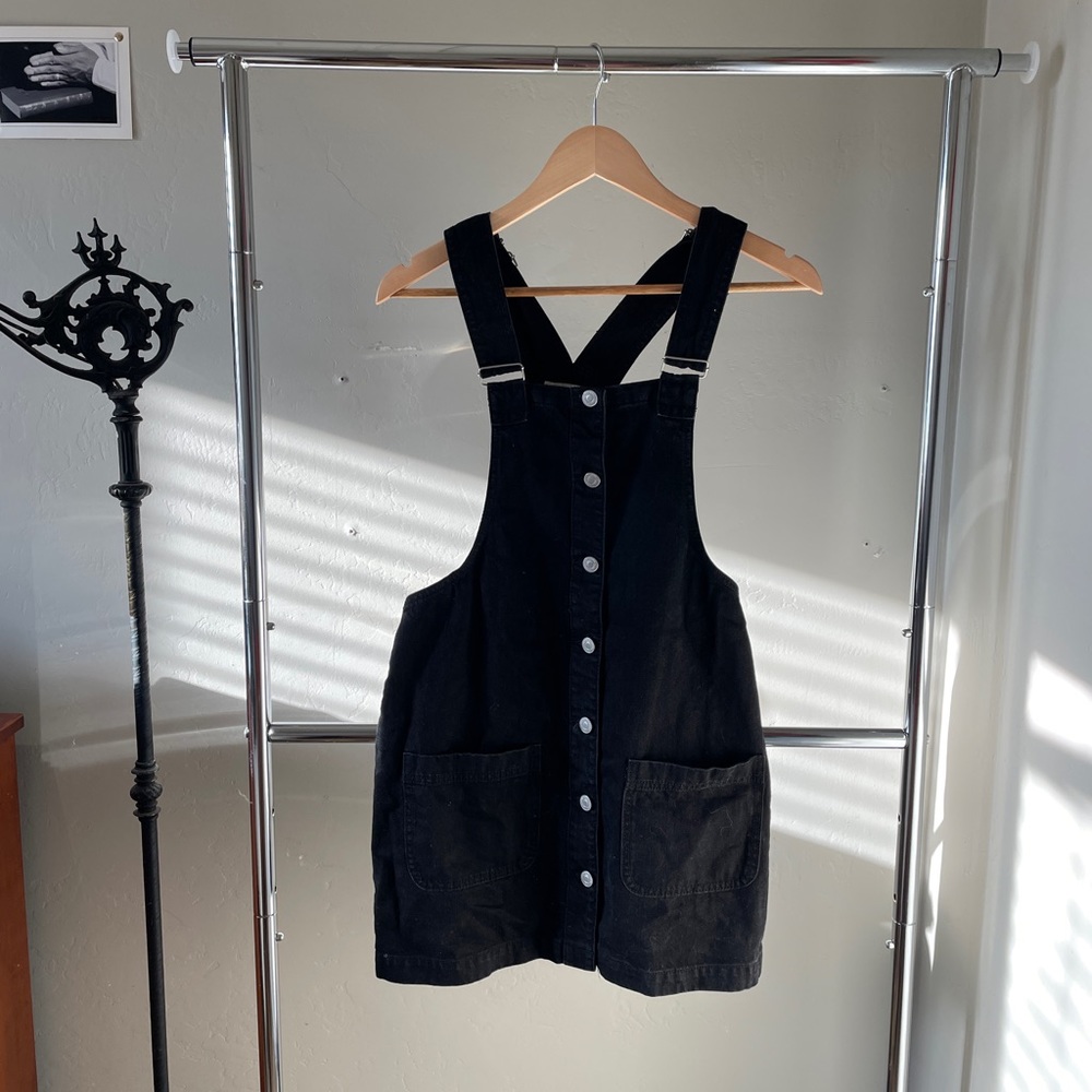Black denim skirt overalls.